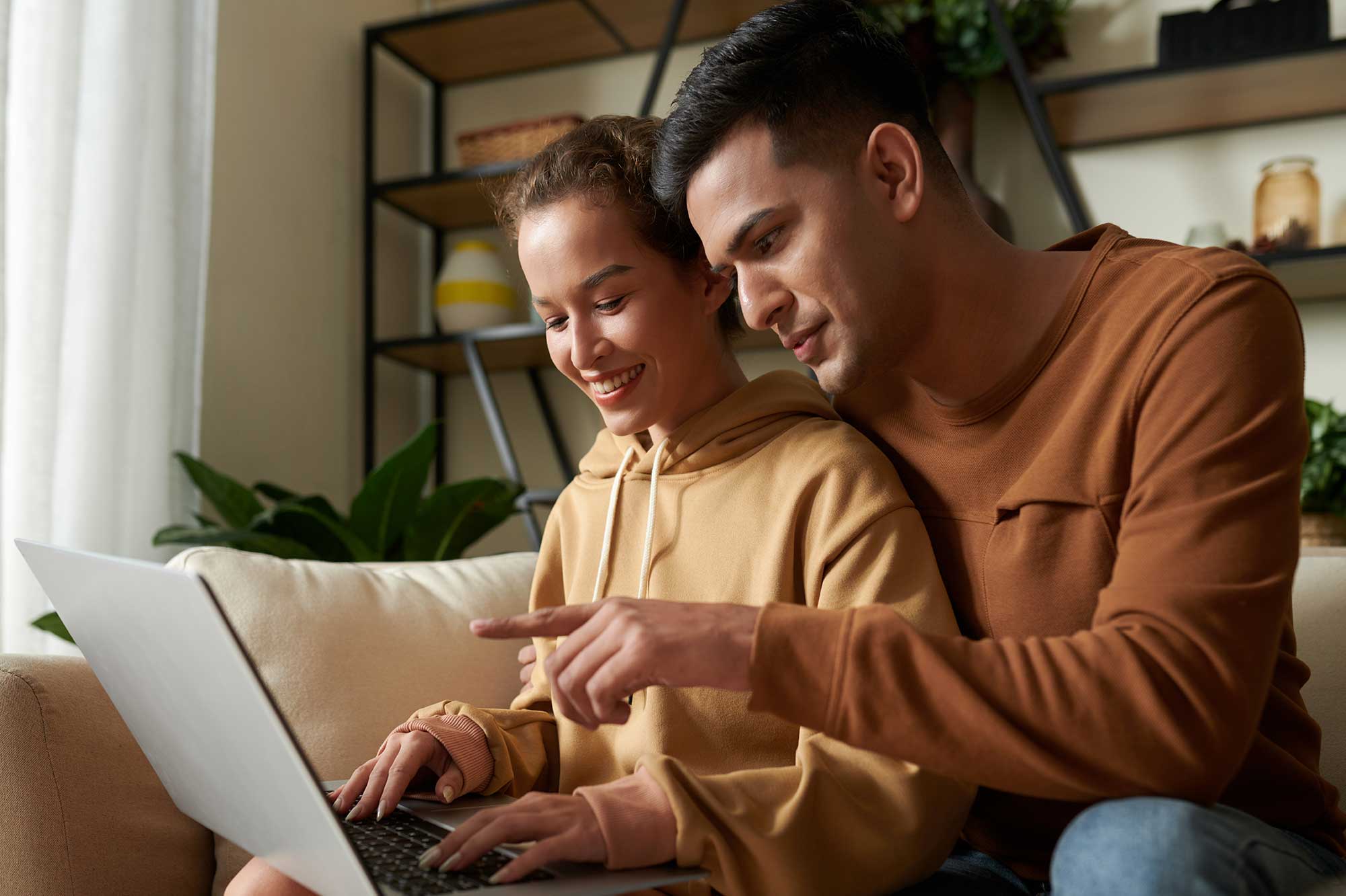 couple-using-laptop-together-at-home-2022-02-28-21-47-44-utc.jpg