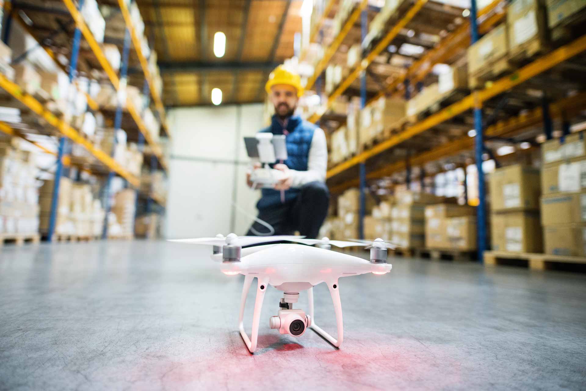 man-with-drone-in-a-warehouse-PMQEJ35-2.jpg