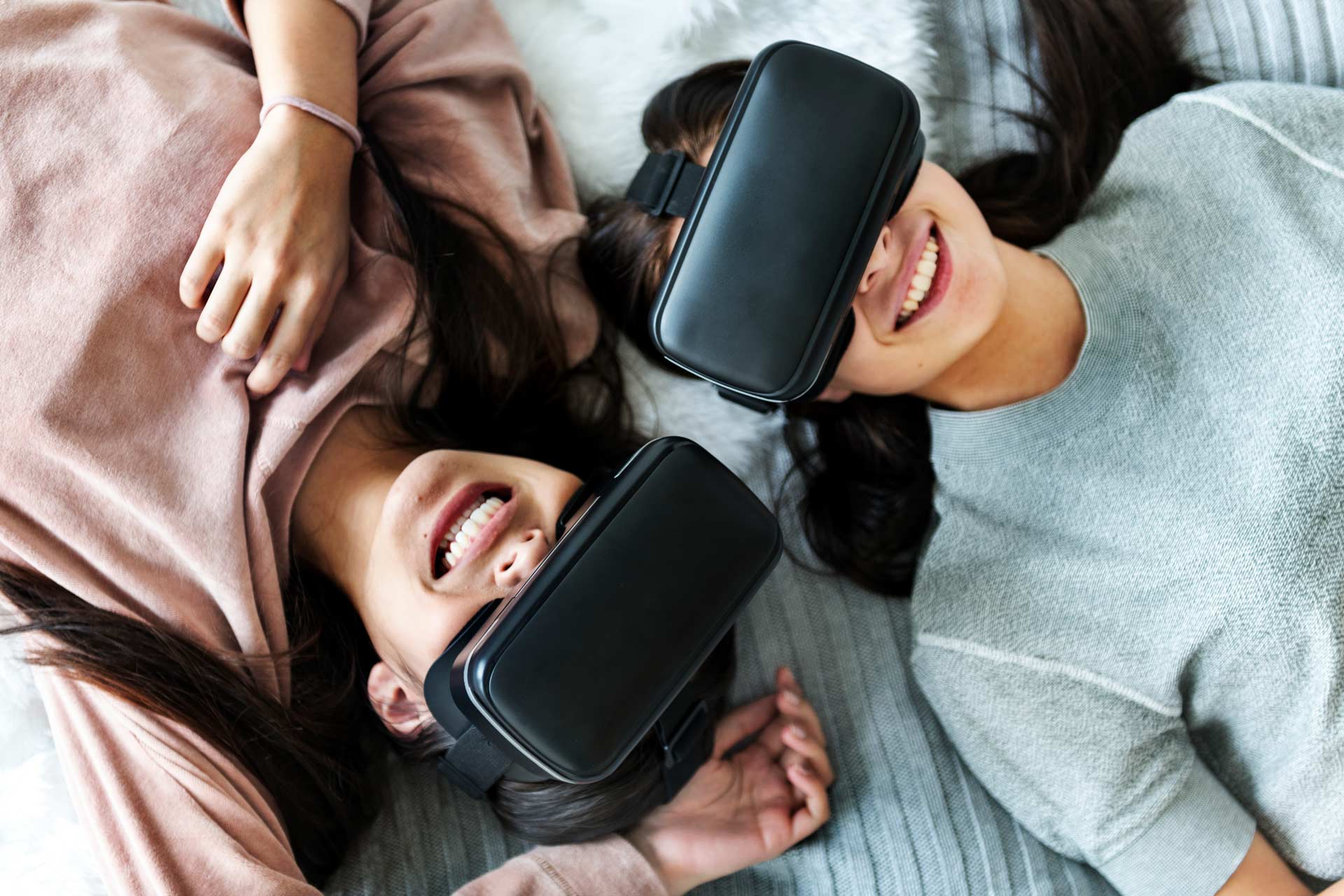 women-experiencing-virtual-reality-with-vr-headset-P8EWPYR-2.jpg